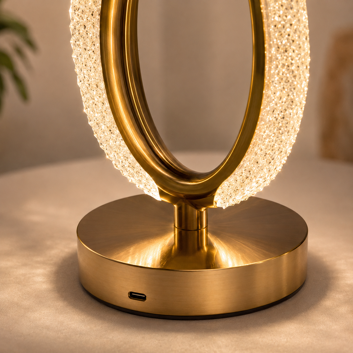 Close-up of the crystal halo and polished gold base with USB charging port