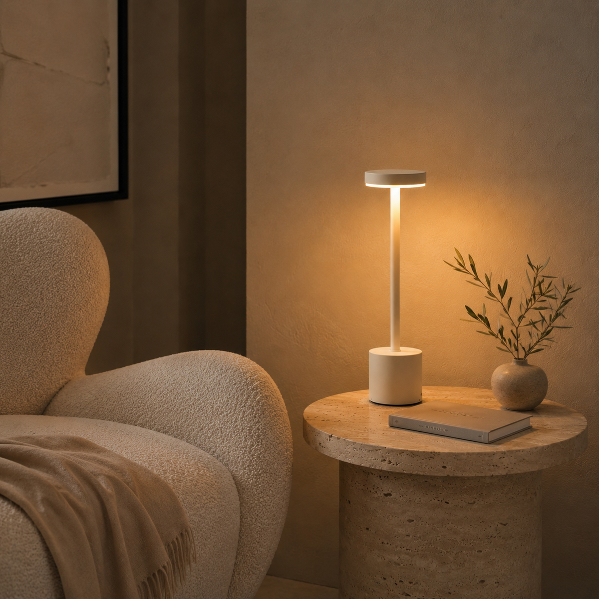 Lumi rechargeable table lamp in white on a round stone side table