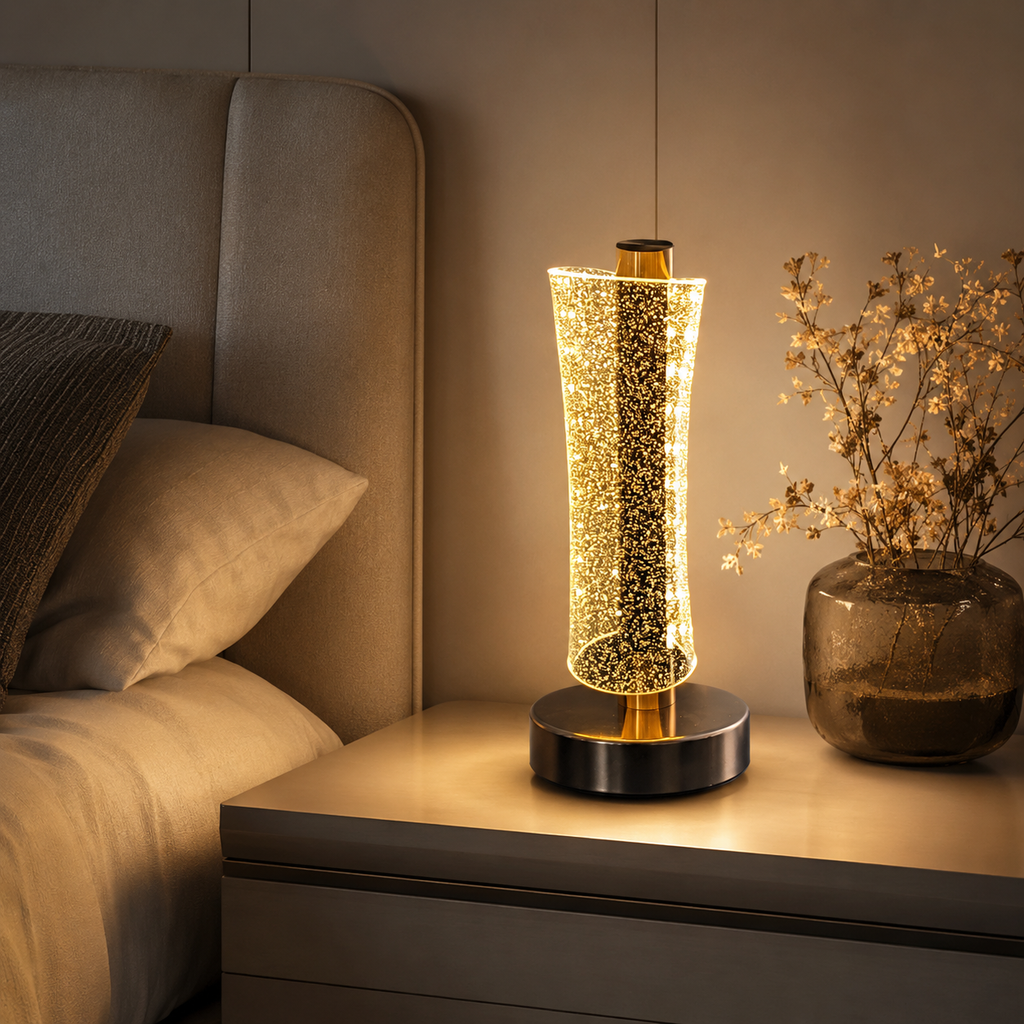 Modern LED crystal table lamp glowing warm on a bedroom nightstand