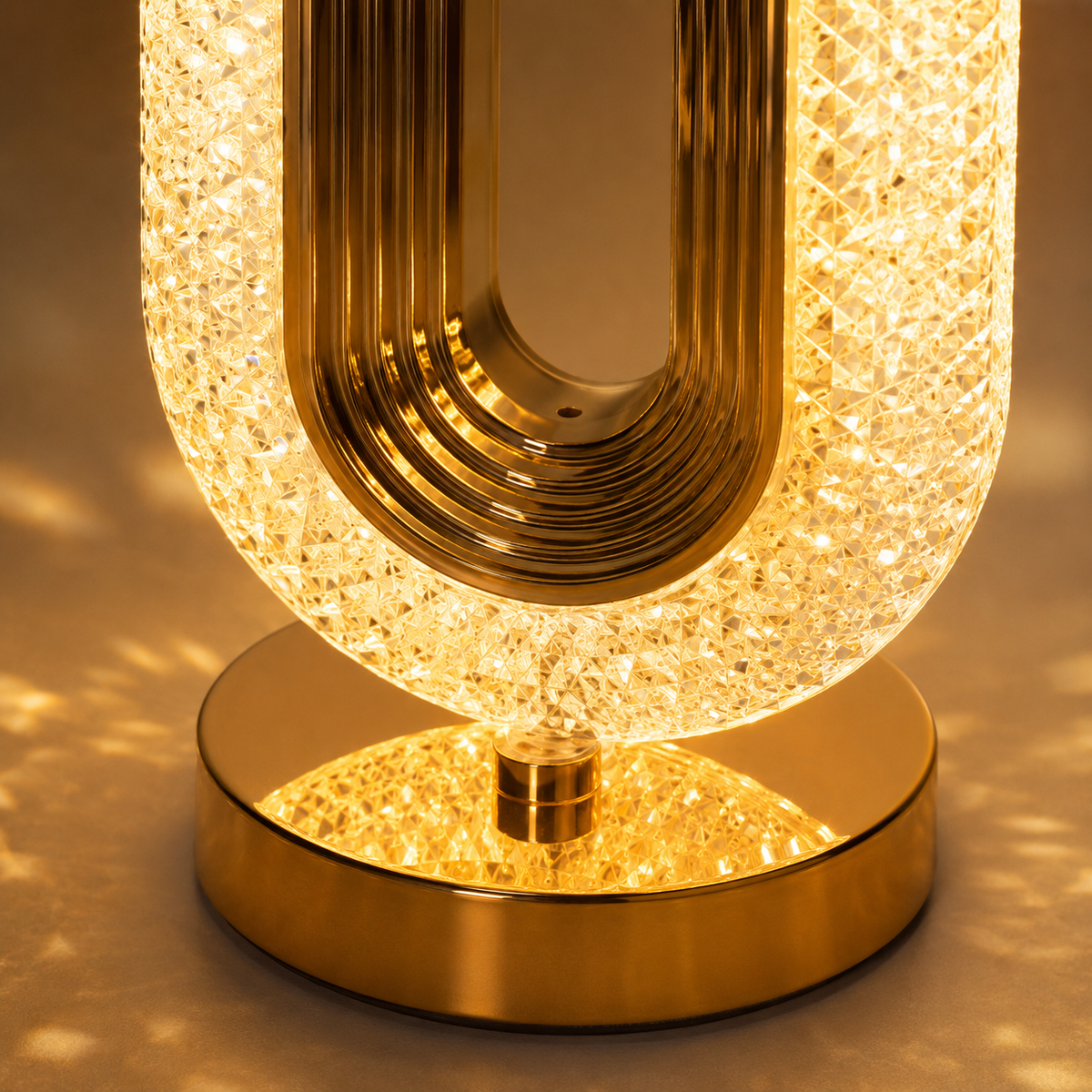 Close-up of the faceted crystal ring and ribbed gold frame