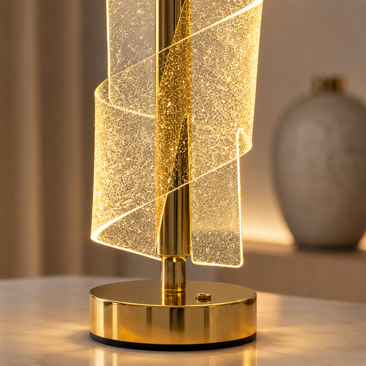 Close-up of the sparkling spiral crystal shade and polished gold base